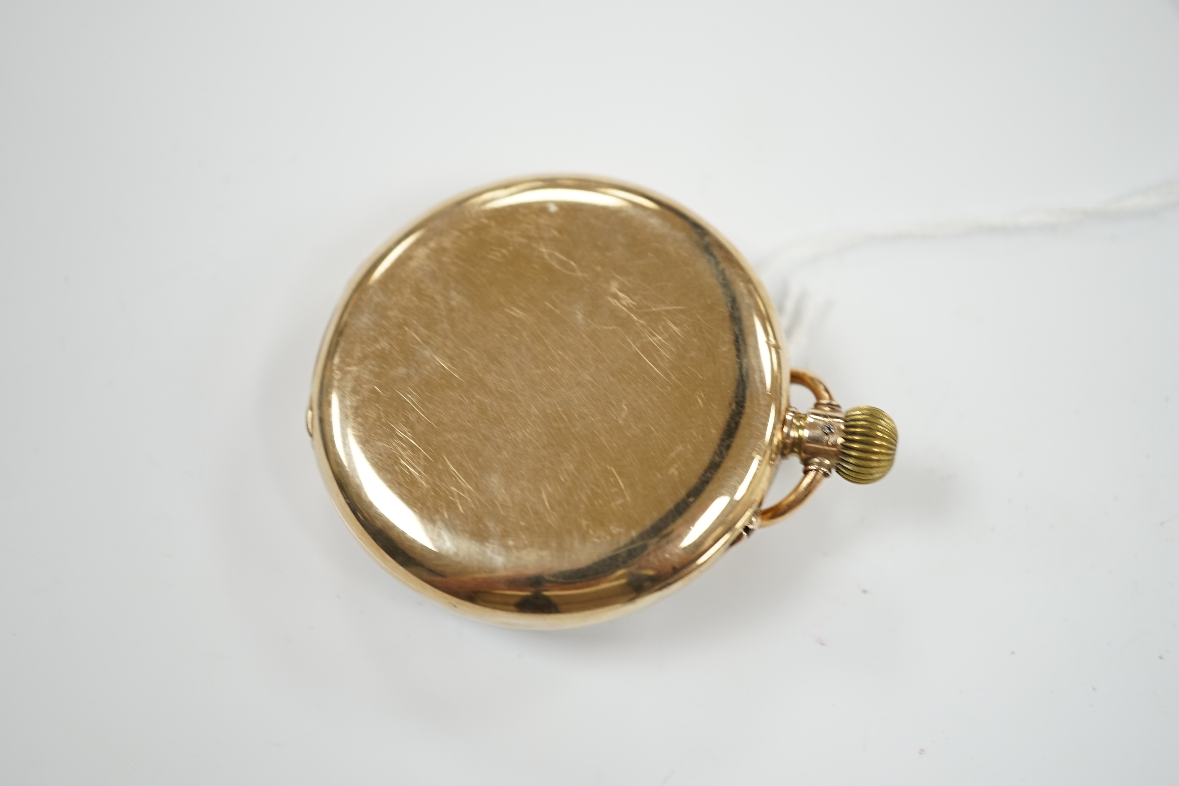 A George V 9ct gold open face keyless pocket watch, with Roman dial and subsidiary seconds, case diameter 50mm, gross weight 83.4 grams.